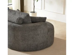 Sillón con soporte lumbar y reposacabezas, tapizado en tela de chenilla gris.