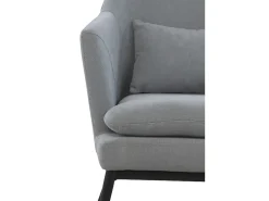 Sillón tapizado color gris perla con cojín y patas de metal negras